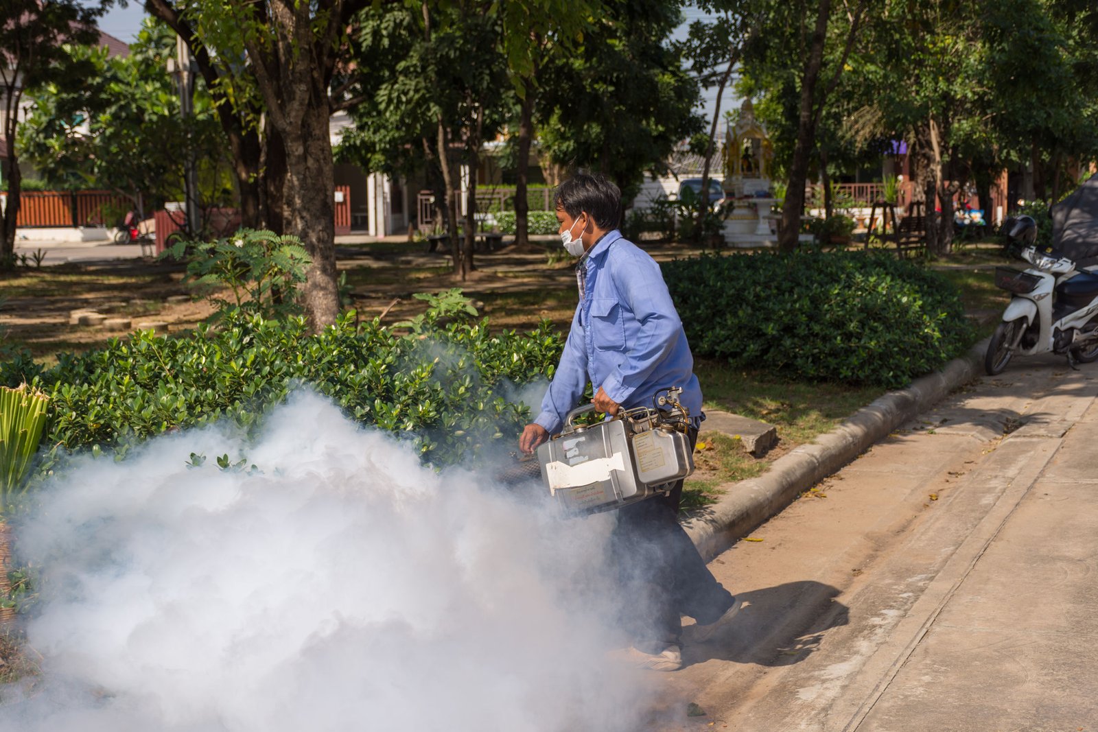 Bangkok, Thailand - November 19, 2016 : Unidentified people fogging DDT spray kill mosquito for control Malaria, Encephalitis, Dengue and Zika in village at Bangkok Thailand.